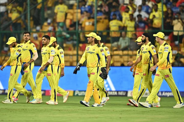 Chennai Super Kings' players arrive at the start of Indian Premier League (IPL) Twenty20 cricket match between Royal Challengers Bengaluru and Chennai Super Kings at the M Chinnaswamy Stadium in Bengaluru 