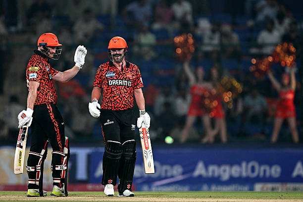 Sunrisers Hyderabad's Heinrich Klaasen (L) gestures next to his teammate Travis Head during the Indian Premier League (IPL) Twenty20 cricket match between Kolkata Knight Riders and Sunrisers Hyderabad at the Arun Jaitley Stadium